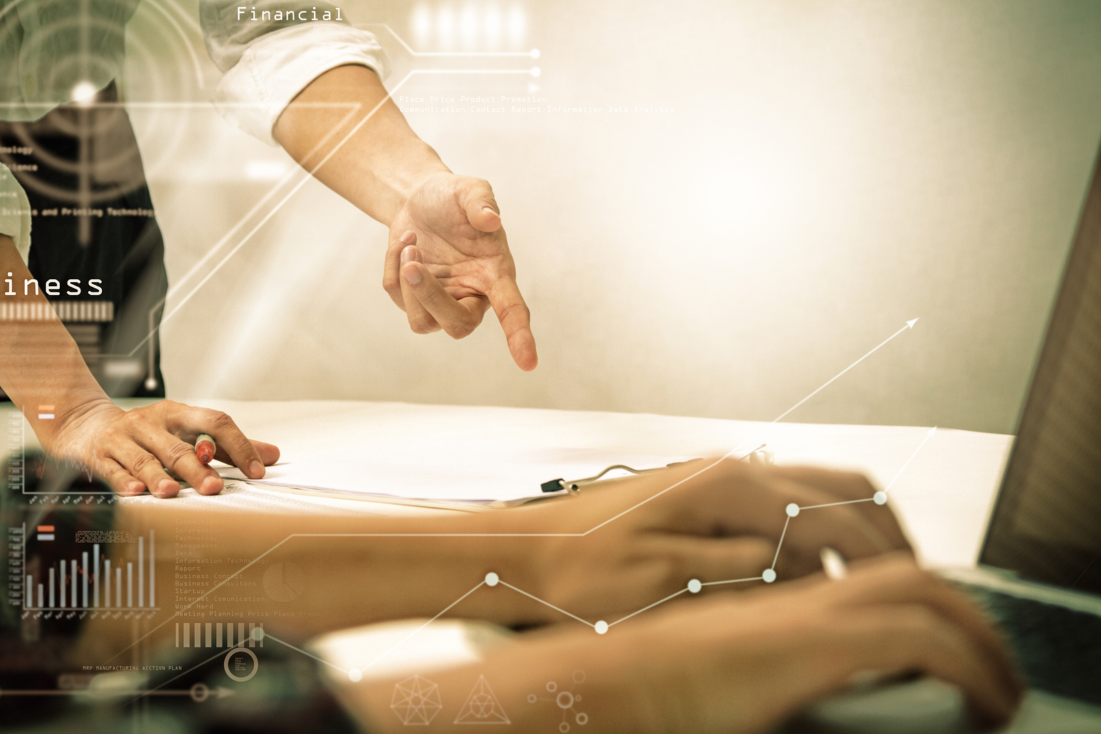 A person pointing at something on the table